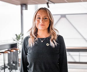 Blonde woman in black shirt